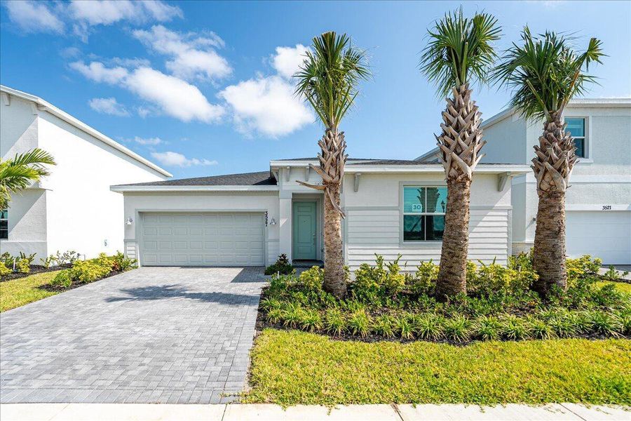 Front exterior of a new home in Seagrove: The Indies, Fort Pierce, FL, highlighting curb appeal (Image 24).