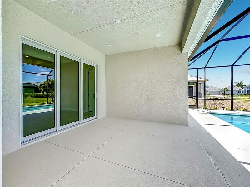 Exterior details and patio area of a home in Watercolor Place, Bradenton (Image 31).