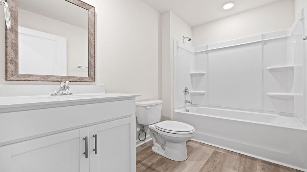 Furnished interior view inside a new home in Lakestone, Woodruff (Image 4).