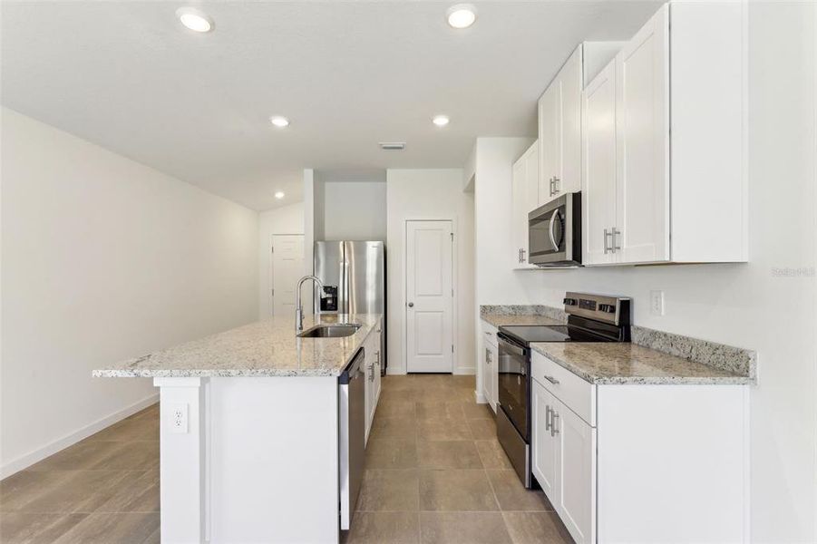 Furnished interior view inside a new home in Flagler Village - Classic Series, Palm Coast (Image 10).