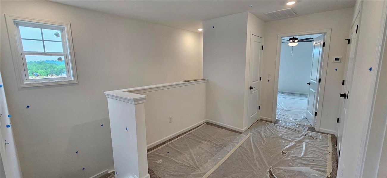 This bright hallway connects to a spacious room, o This bright hallway connects to a spacious room, o
