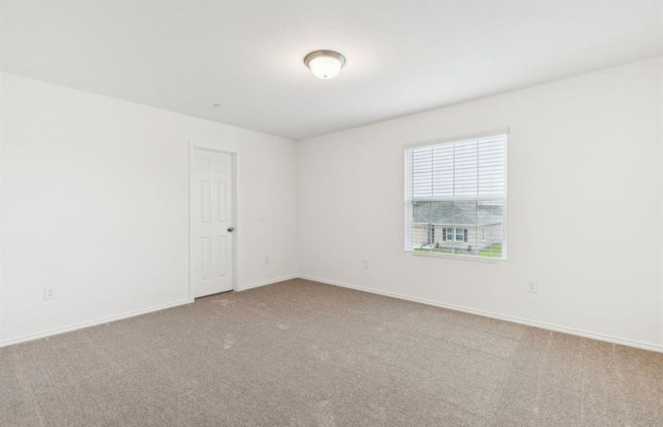 Spacious secondary bedroom with large windows