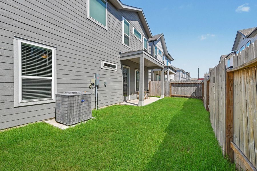 The backyard offers plenty of green space for pets, play, or simply enjoying time outdoors. The backyard offers plenty of green space for pets, play, or simply enjoying time outdoors.