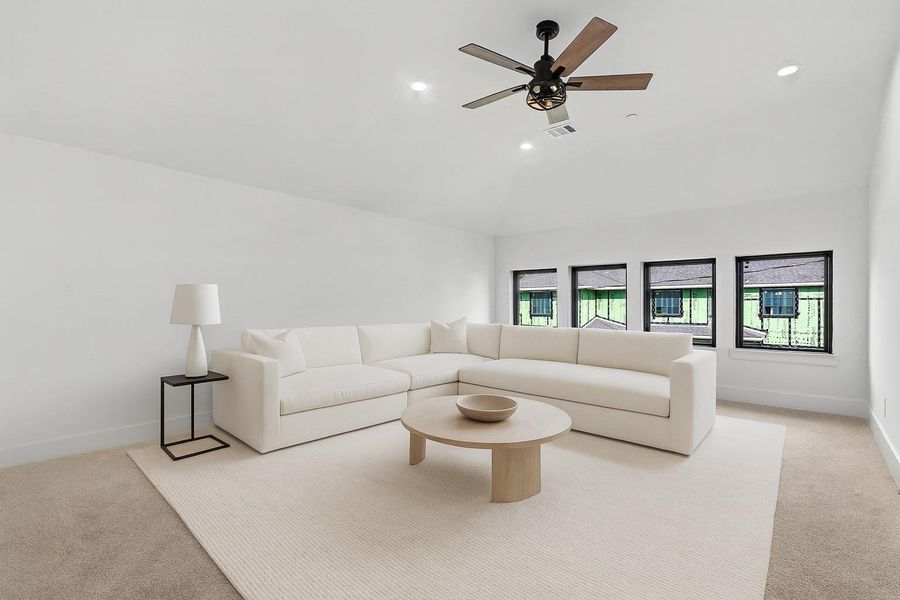 *VIRTUALLY STAGED* Spacious gameroom located upstairs offers extra entertainment space in this functional home.