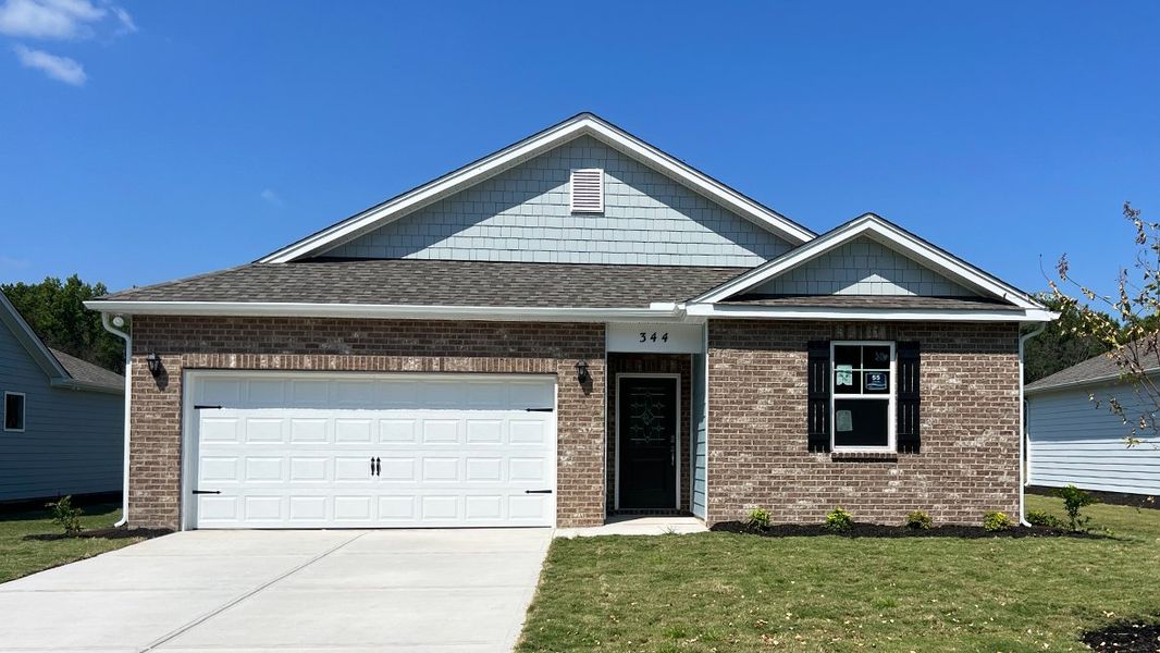 Front exterior of a new home in Sease's Pond, Gilbert, SC, highlighting curb appeal (Image 1).
