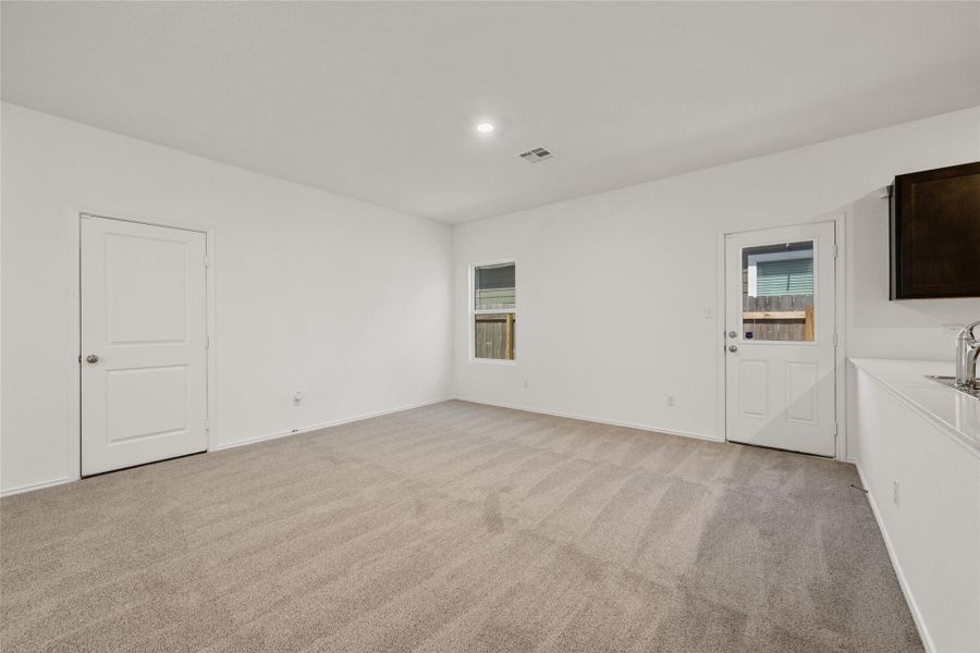 Spare room featuring light carpet and recessed lighting Spare room featuring light carpet and recessed lighting