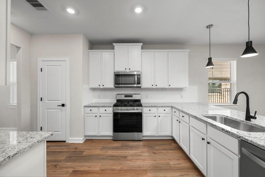 Furnished interior view inside a new home in Sunterra, Katy (Image 6).