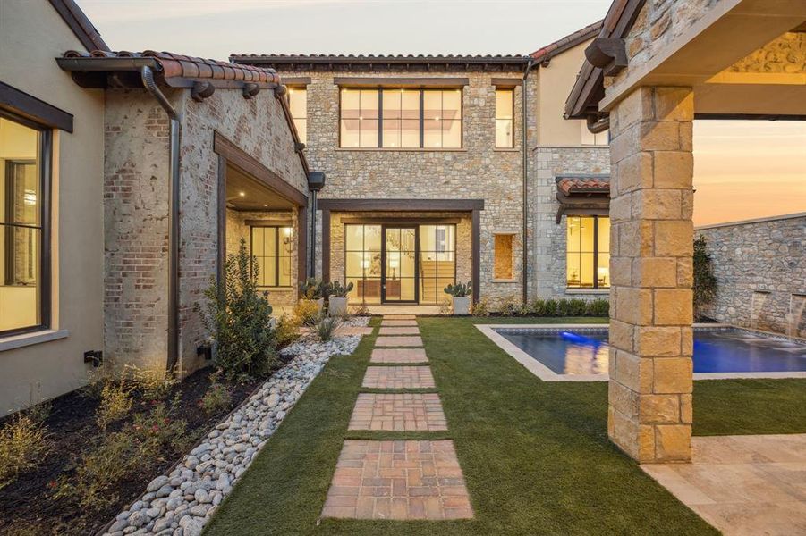 Front exterior of a new home in , Westlake, TX, highlighting curb appeal (Image 22). Front exterior of a new home in , Westlake, TX, highlighting curb appeal (Image 22).