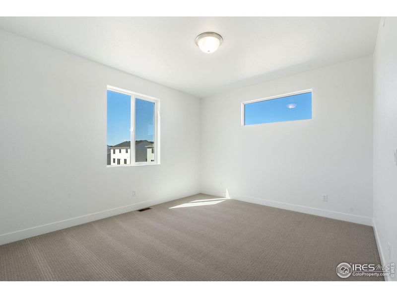 Spacious, unfurnished interior of a new home in Prairie Song, Windsor (Image 38).