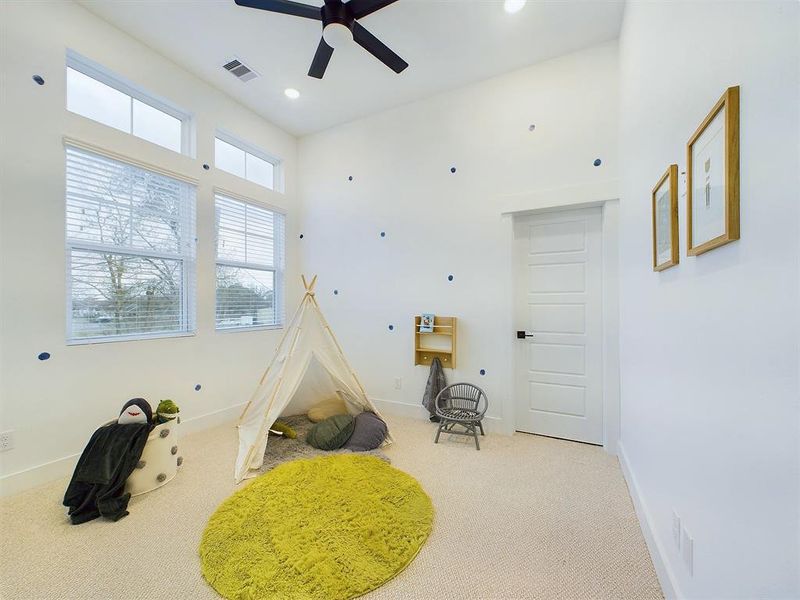 Secondary Bedroom offering high ceilings and top windows for amazing natural lighting.