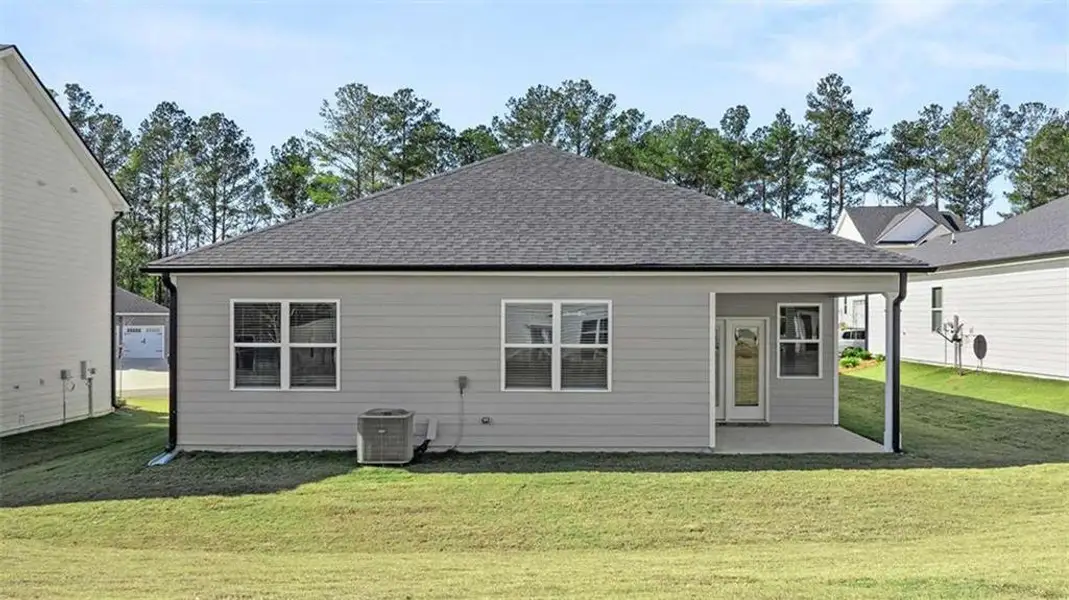 Exterior details and patio area of a home in Oakchase at Hampton, Hampton (Image 4). Exterior details and patio area of a home in Oakchase at Hampton, Hampton (Image 4).