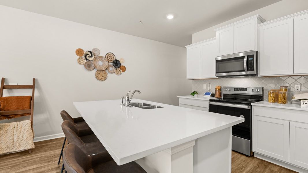 Representative furnished interior of a home built from the Stratford by D.R. Horton in Echo Glen, Stockbridge (Image 4).