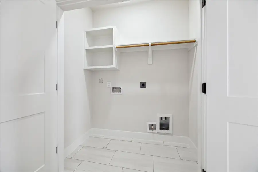 Efficiently designed utility closet with ample storage and convenient washer/dryer hookups. Efficiently designed utility closet with ample storage and convenient washer/dryer hookups.