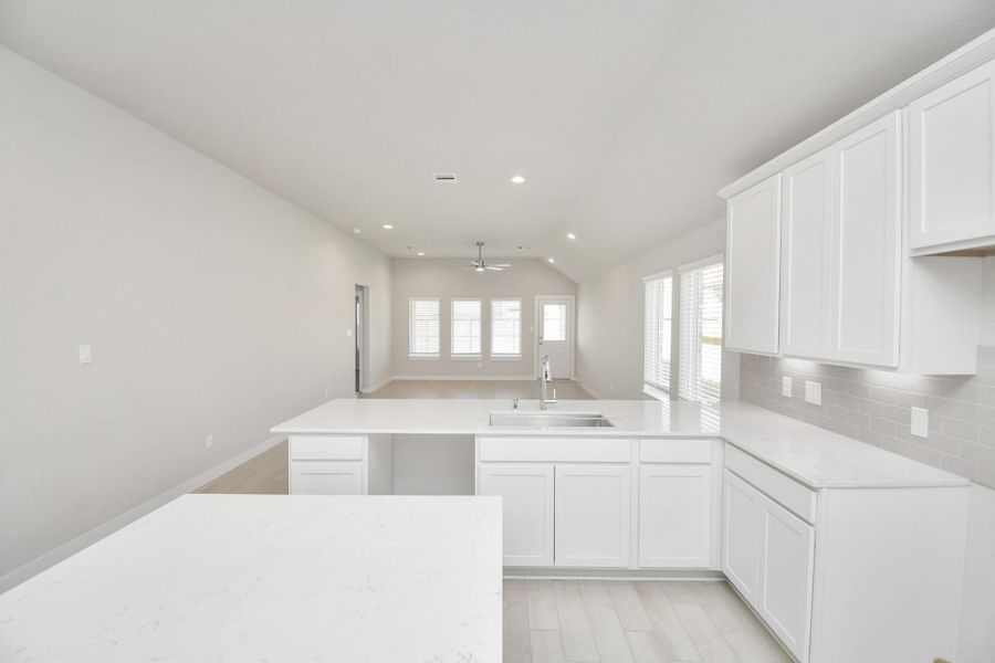 This generously spacious kitchen is a dream realized! Sample photo of completed home with similar floor plan. Actual colors and selections may vary. This generously spacious kitchen is a dream realized! Sample photo of completed home with similar floor plan. Actual colors and selections may vary.