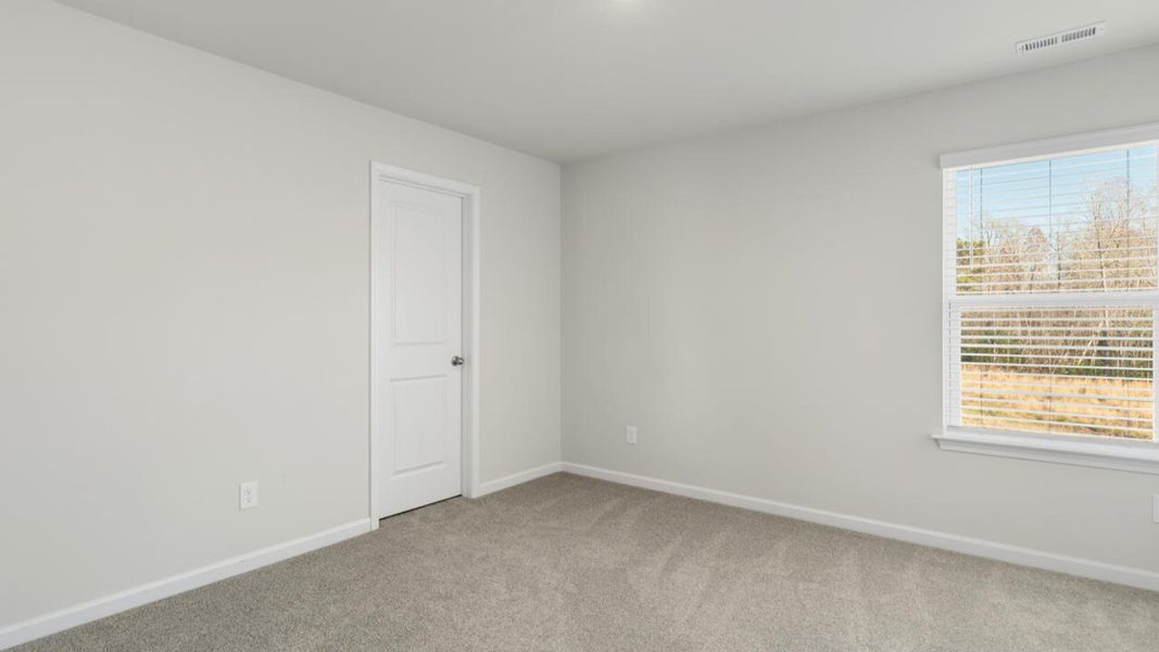 Spacious, unfurnished interior of a new home in The Preserve at Tidewater, Sneads Ferry (Image 38).