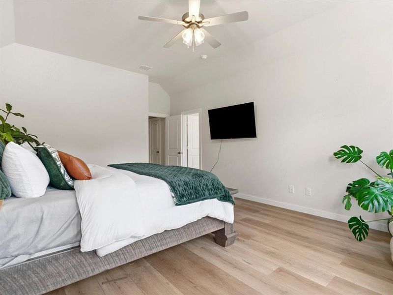 Private primary suite with spacious layout and peaceful views of the surrounding property.