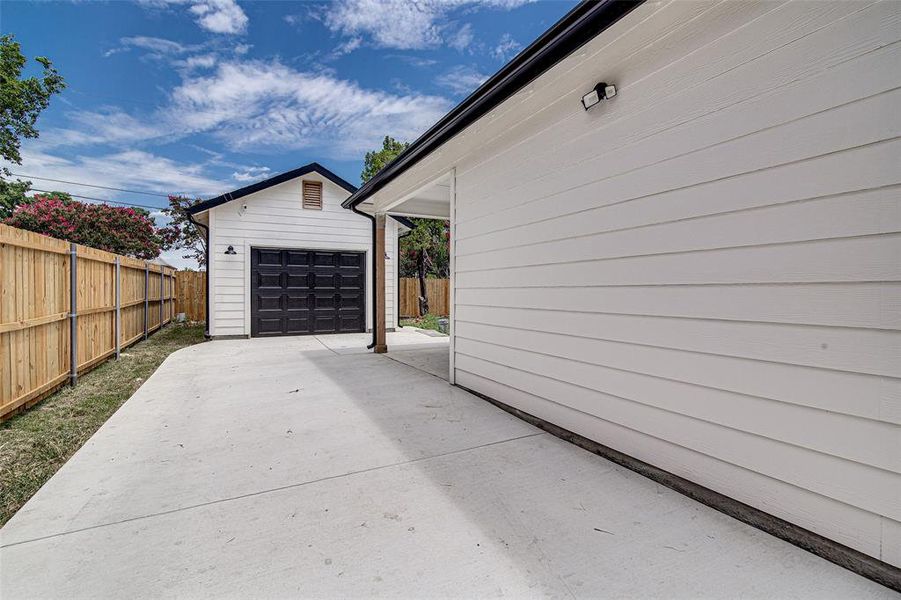 Garage with concrete driveway