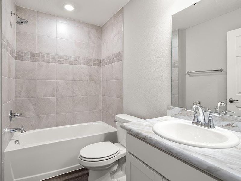 Secondary bedrooms share a convenient hall bath.