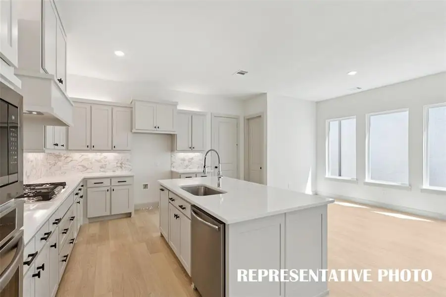 Fantastic storage paired with beautiful finishes combine to create the kitchen of your dreams in our Bella plan!  REPRESENTATIVE PHOTO