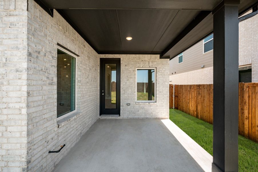 Exterior details and patio area of a home in Wildflower Ranch, Fort Worth (Image 21).