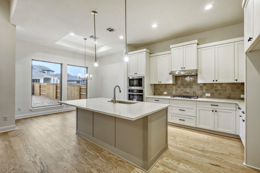 Furnished interior view inside a new home in 6 Creeks, Kyle (Image 4).