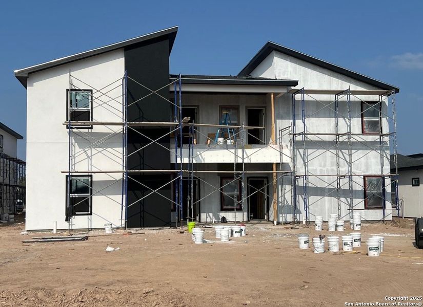 Front exterior of a new home in , Weslaco, TX, highlighting curb appeal (Image 5).