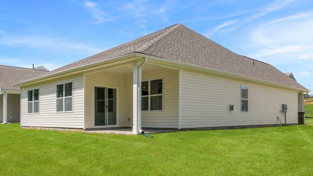 Exterior details and patio area of a home in Sherwood Gardens, Landrum (Image 23).