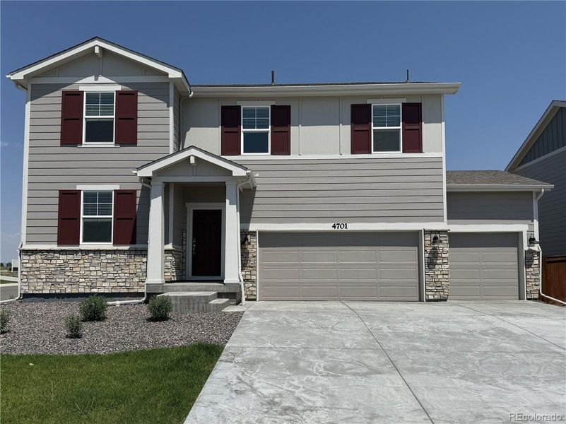 Front exterior of a new home in Revere at Johnstown, Johnstown, CO, highlighting curb appeal (Image 1). Front exterior of a new home in Revere at Johnstown, Johnstown, CO, highlighting curb appeal (Image 1).