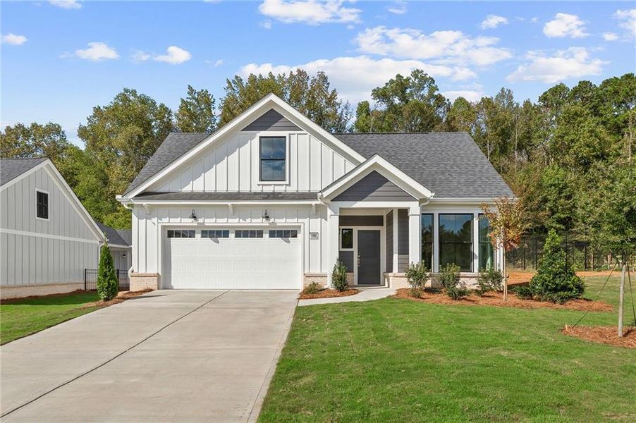 Front exterior of a new home in The Courtyards by The Manor, Alpharetta, GA, highlighting curb appeal (Image 2). Front exterior of a new home in The Courtyards by The Manor, Alpharetta, GA, highlighting curb appeal (Image 2).