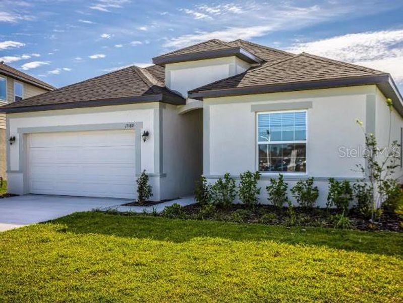 Front exterior of a new home in Oakstone Farms, Leesburg, FL, highlighting curb appeal (Image 21).