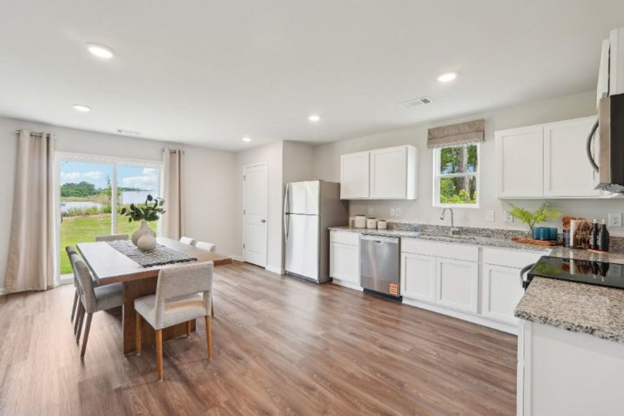 A kitchen with white cabinets. A kitchen with white cabinets.