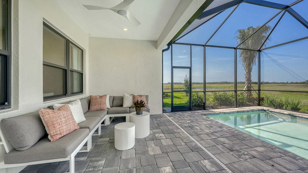 Exterior details and patio area of a home in SkySail Real Estate and Homes for Sale in Naples, FL - Neal Communities, Naples (Image 3).