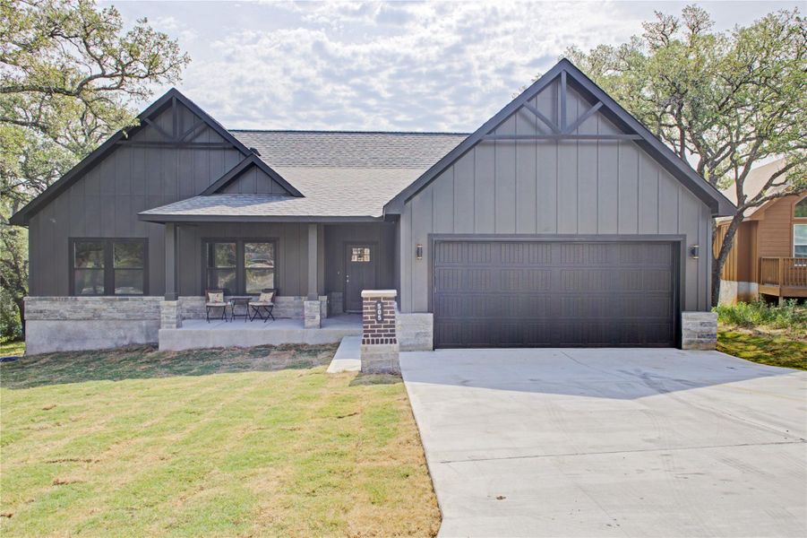 Front exterior of a new home in , Spicewood, TX, highlighting curb appeal (Image 1).