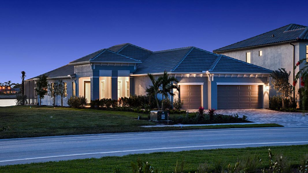 Front exterior of a new home in SkySail Real Estate and Homes for Sale in Naples, FL - Neal Communities, Naples, FL, highlighting curb appeal (Image 2). Front exterior of a new home in SkySail Real Estate and Homes for Sale in Naples, FL - Neal Communities, Naples, FL, highlighting curb appeal (Image 2).