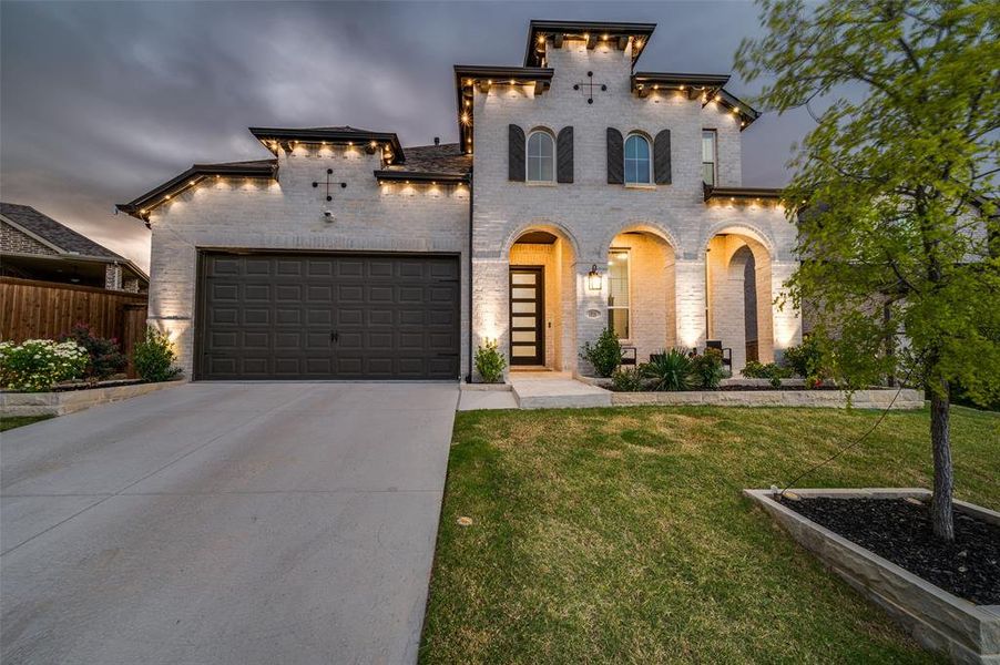 Front exterior of a new home in Sandbrock Ranch: 50ft. lots, Aubrey, TX, highlighting curb appeal (Image 21).