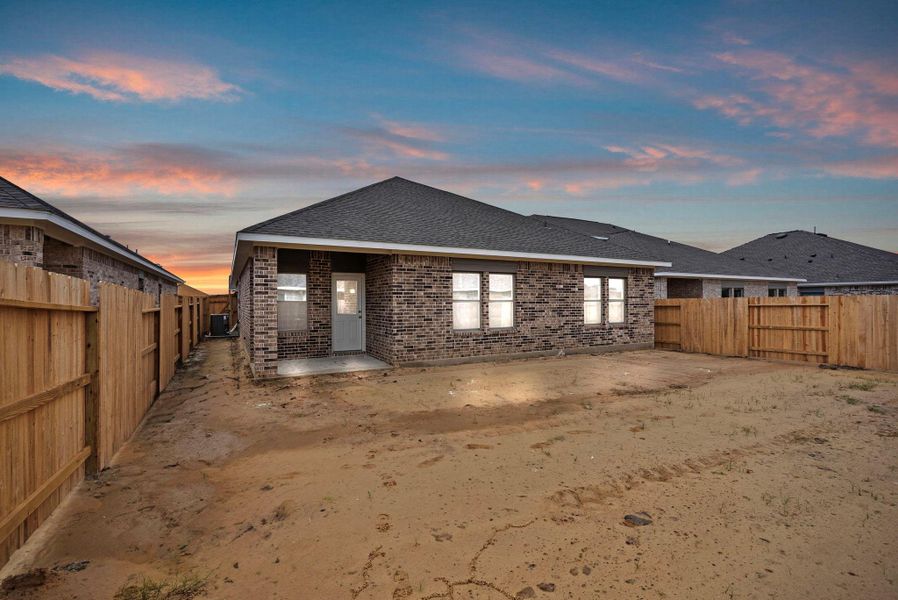 Exterior details and patio area of a home in Windrose Green 50', Angleton (Image 3).