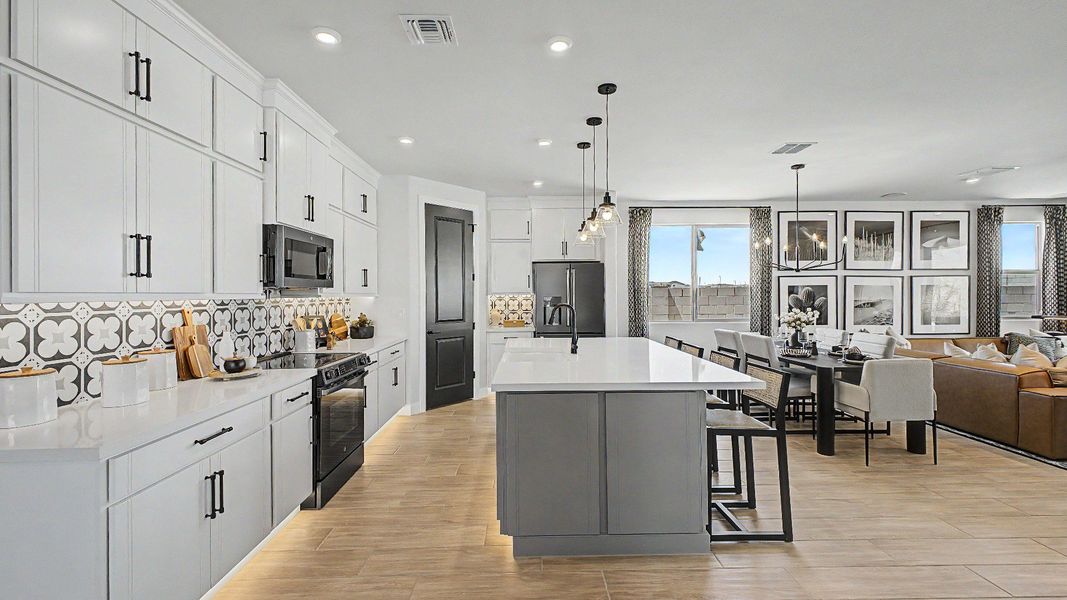 Modern gray kitchen cabinets in this quick move-in new home by DRB Homes at Saguaro Hills at Vistancia. Modern gray kitchen cabinets in this quick move-in new home by DRB Homes at Saguaro Hills at Vistancia.