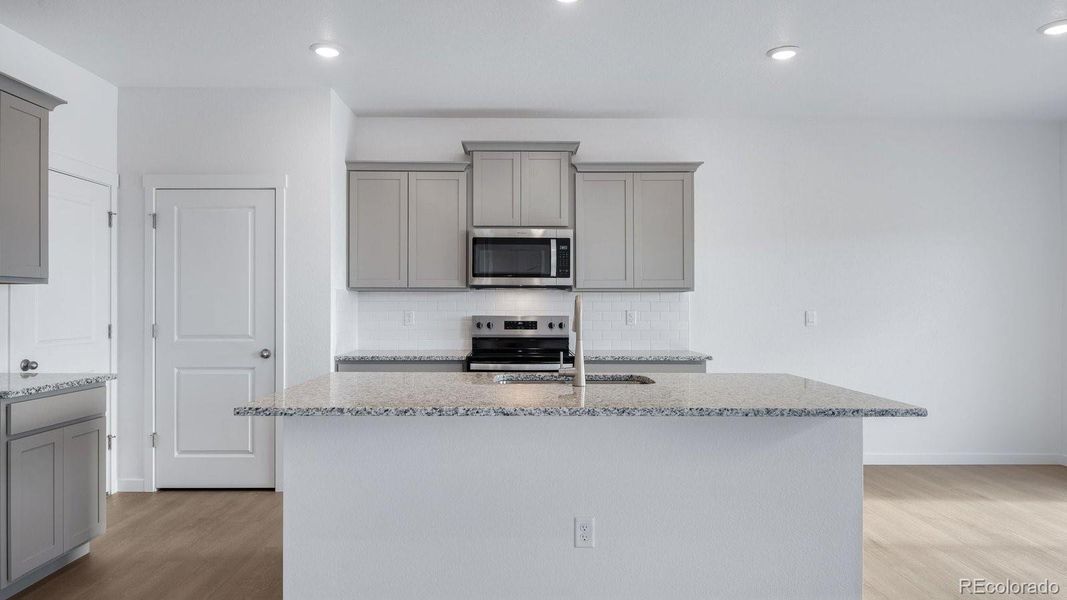 Furnished interior view inside a new home in Settlers Crossing, Commerce City (Image 17).