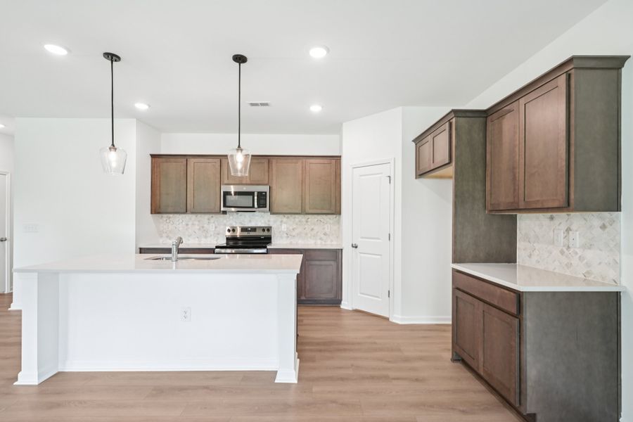 Representative furnished interior of a home built from the Meadow by Ashton Woods in Middleton Farms, Middlesex (Image 4).