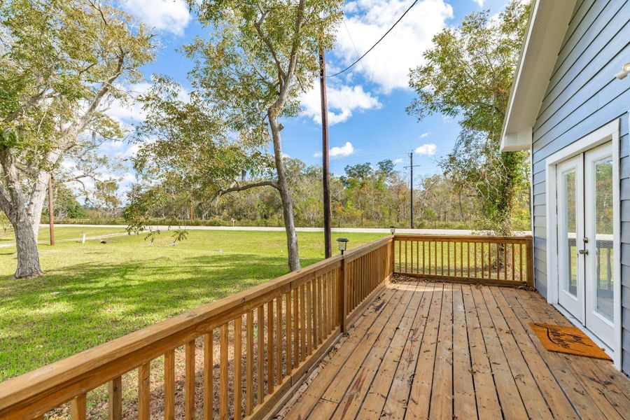 Enjoy peaceful mornings sipping coffee on the spacious deck.