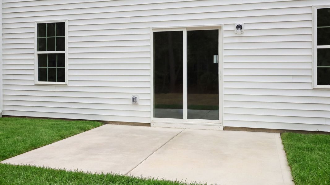 Exterior details and patio area of a home in Ridgewood Farms, Winterville (Image 19).