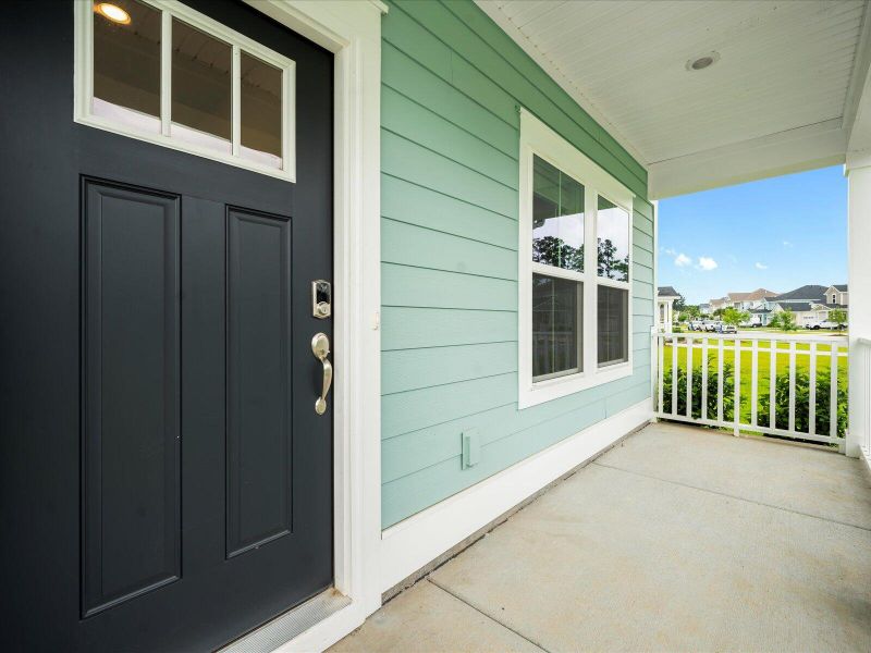 Exterior details and patio area of a home in The Coves at Lakes of Cane Bay, Summerville (Image 4).