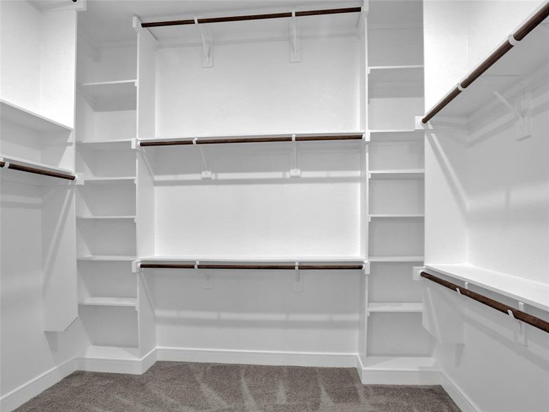 Primary bedroom custom closet.