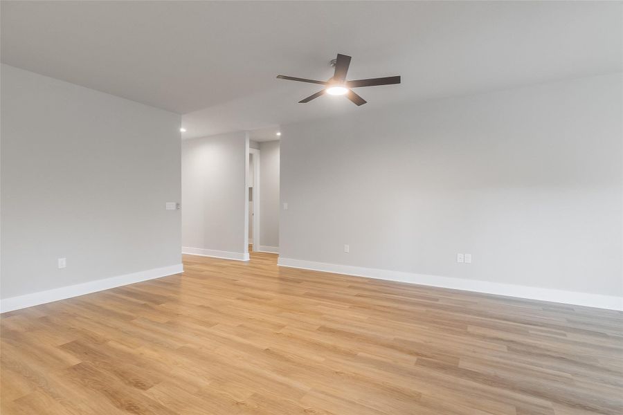 View of living room into entryway and hallway View of living room into entryway and hallway