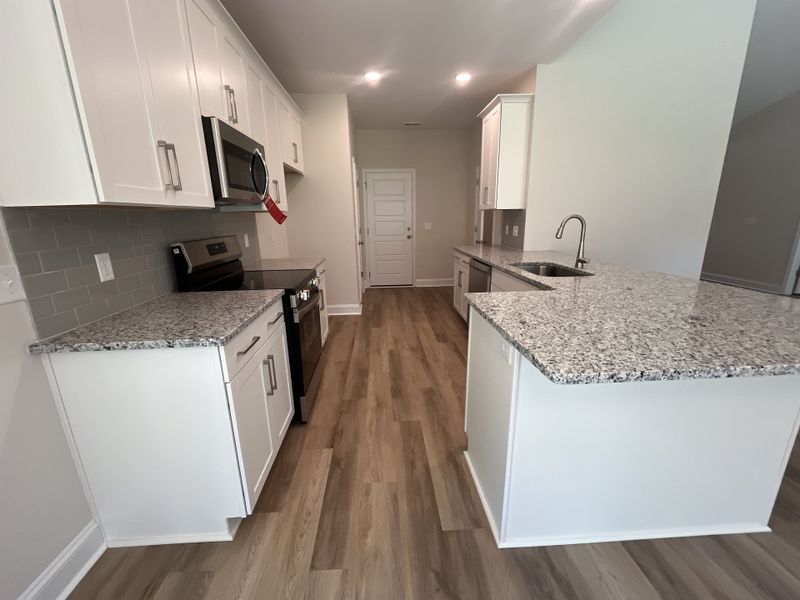 Furnished interior view inside a new home in Parkwood Estates, Leland (Image 6).