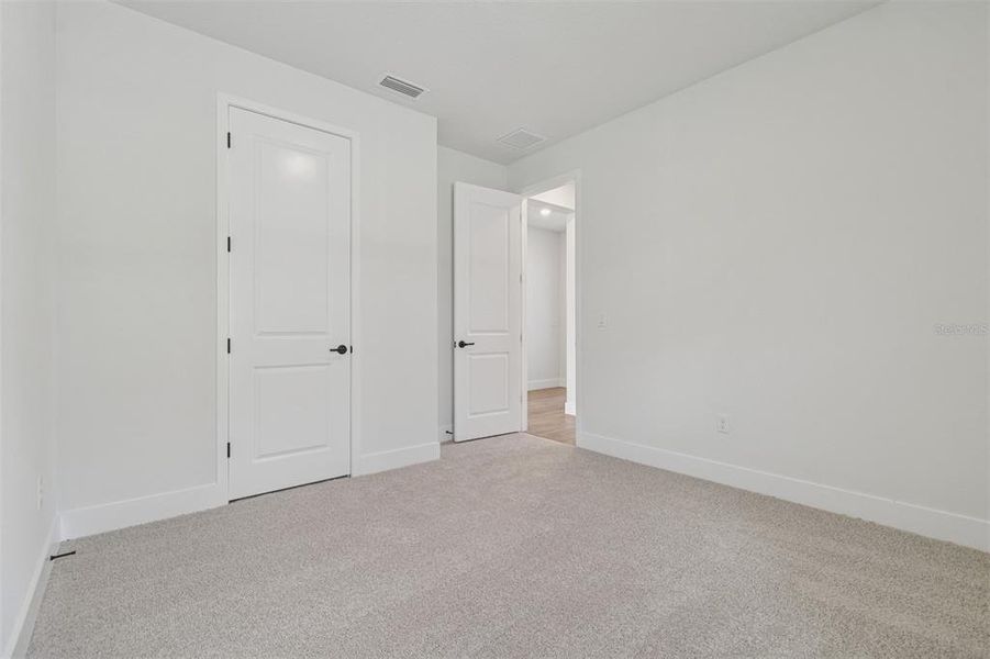 Spacious, unfurnished interior of a new home in The Peninsula at Rhodine Lake, Riverview (Image 23).