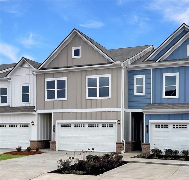 Front exterior of a new home in Townes At The Stiles, Cartersville, GA, highlighting curb appeal (Image 2). Front exterior of a new home in Townes At The Stiles, Cartersville, GA, highlighting curb appeal (Image 2).