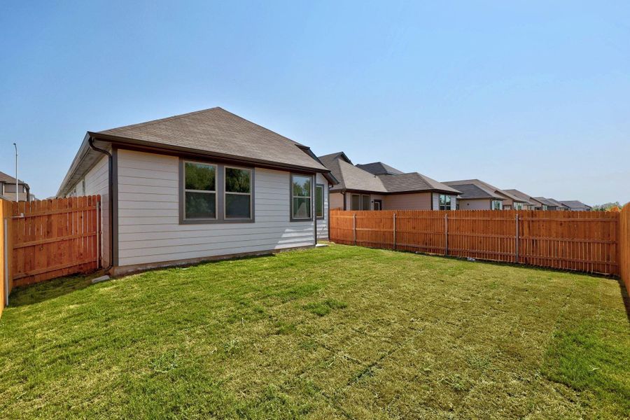Front exterior of a new home in Trinity Ranch, Elgin, TX, highlighting curb appeal (Image 17).