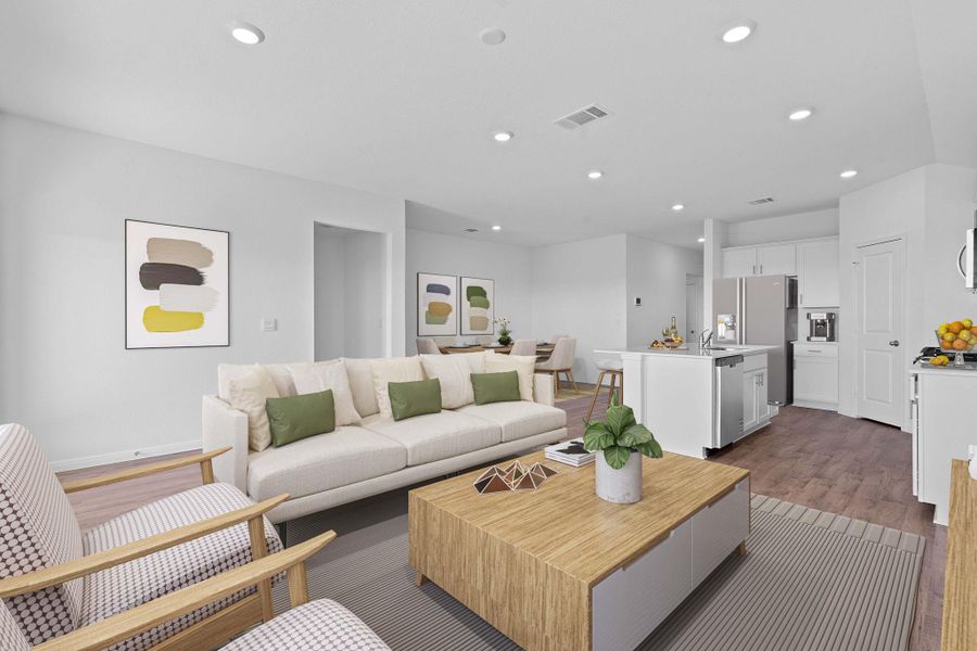 Living room with wood finished floors and recessed lighting