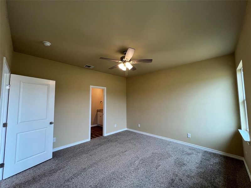 Primary Carpeted Bedroom with Ensuite Bath